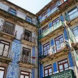 Historic facade in porto decorated with blue hand painted tin-glazed tiles azulejo
